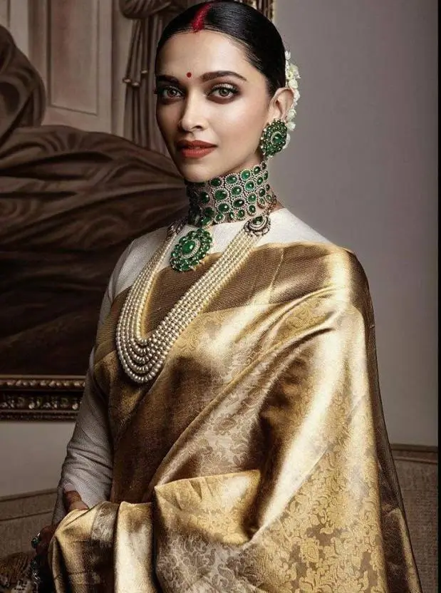 deepika in a golden banarasi saree