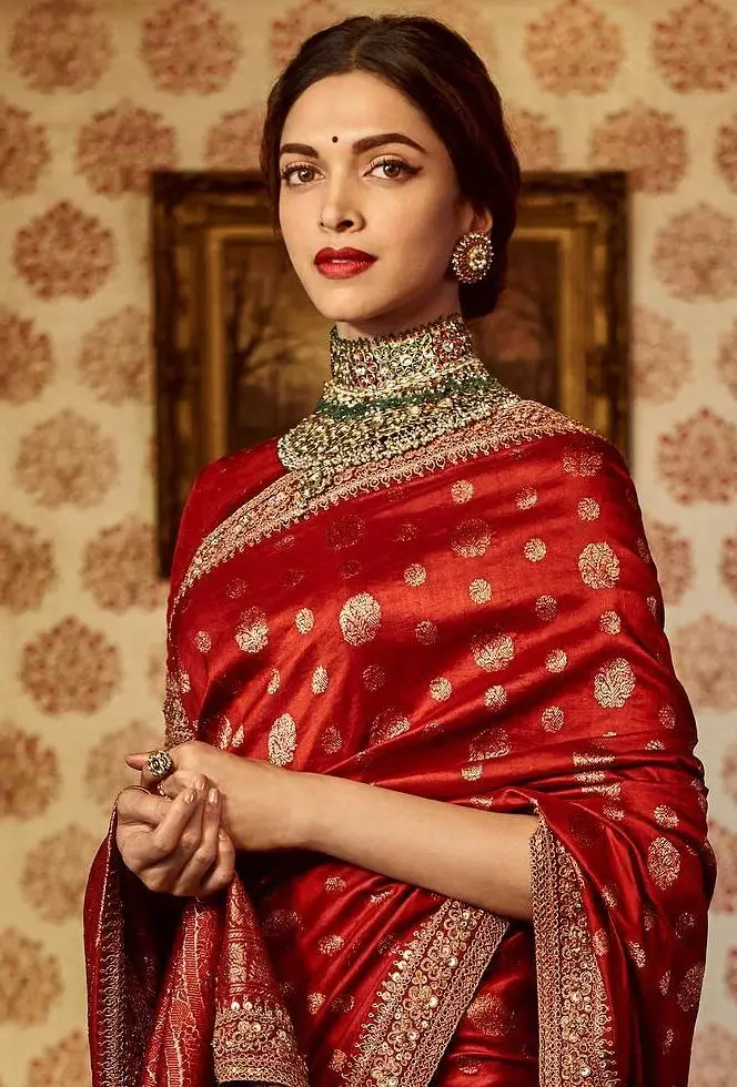 deepika in a red banarasi saree